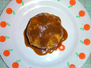Sweet syrupy bailey caramel sauce over sweet potato muffin